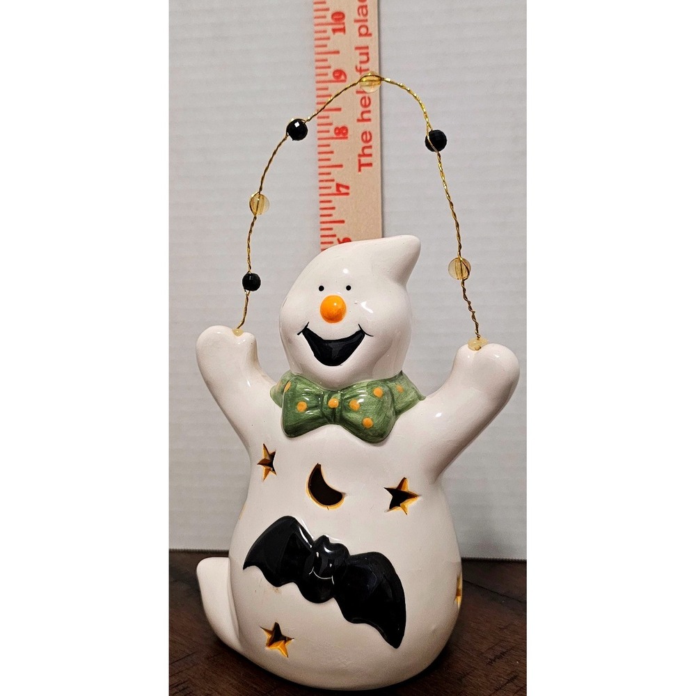 Ceramic Halloween Ghost Figurine has Bat and Bow Star Moon Cutouts Beaded Handle